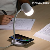 iPhone charging in a white wireless lamp